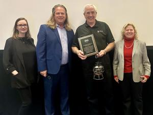 Bob Crawford receiving the 2024 F. Tom Roberts Memorial Volunteer Award