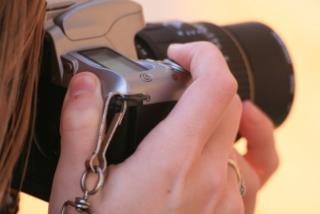 close up of photographer with camera